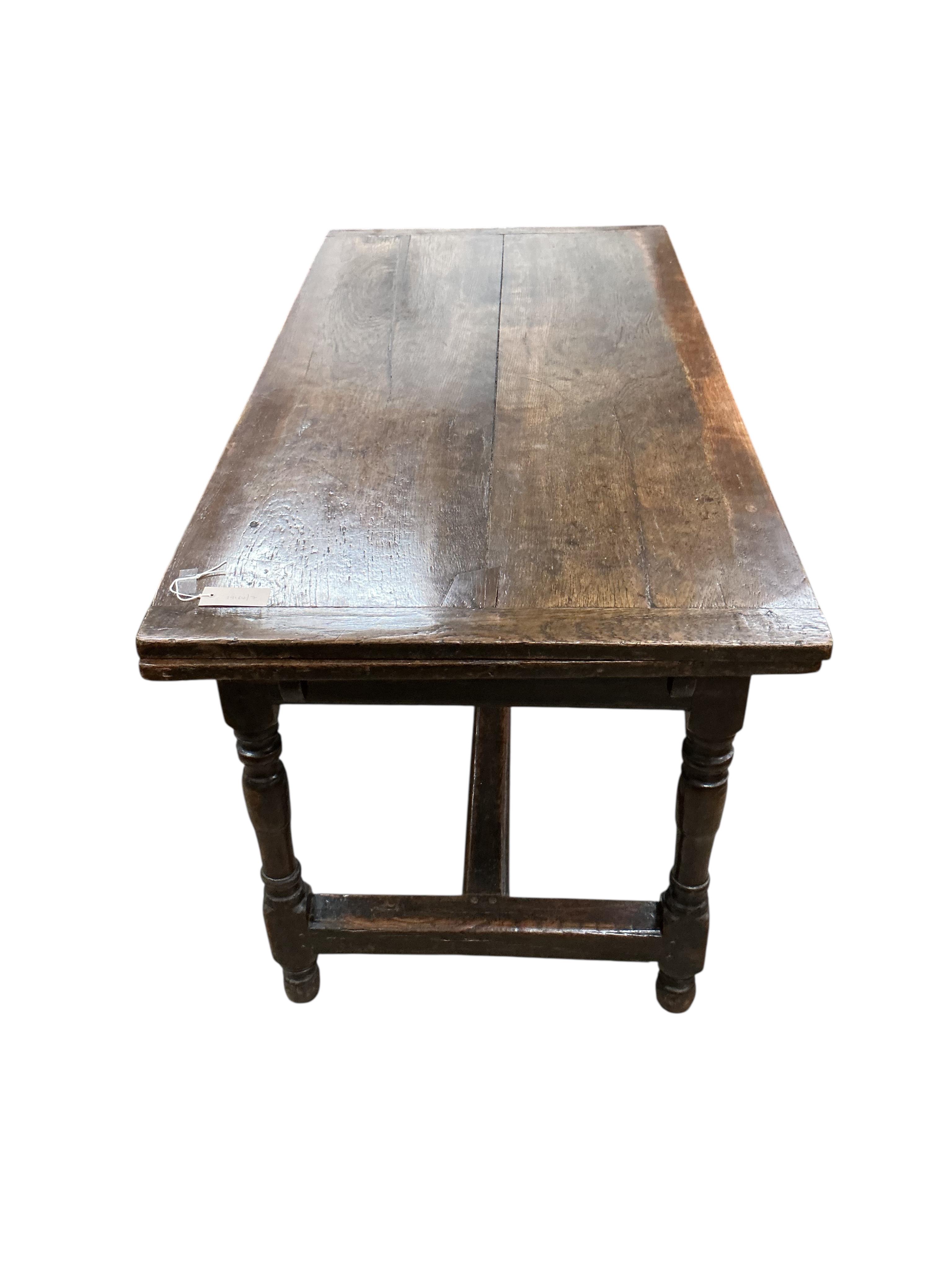 A small 18th century and later rectangular oak draw leaf refectory dining table, width 258cm extended, depth 70cm, height 75cm